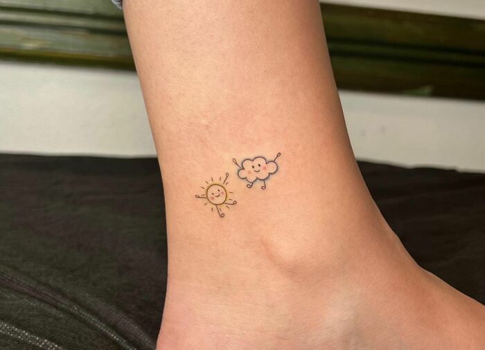 Minimalistic sun and cloud tattoo