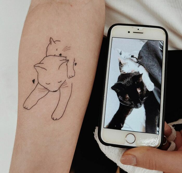 Minimalistic cats hugging tattoo