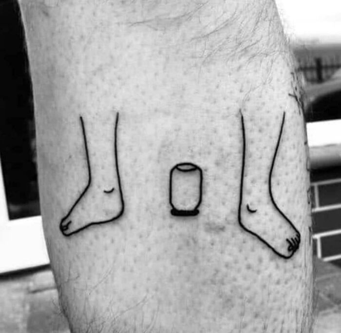 Two feet and a cup tattoo 