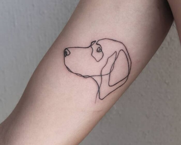 Single line dog head tattoo