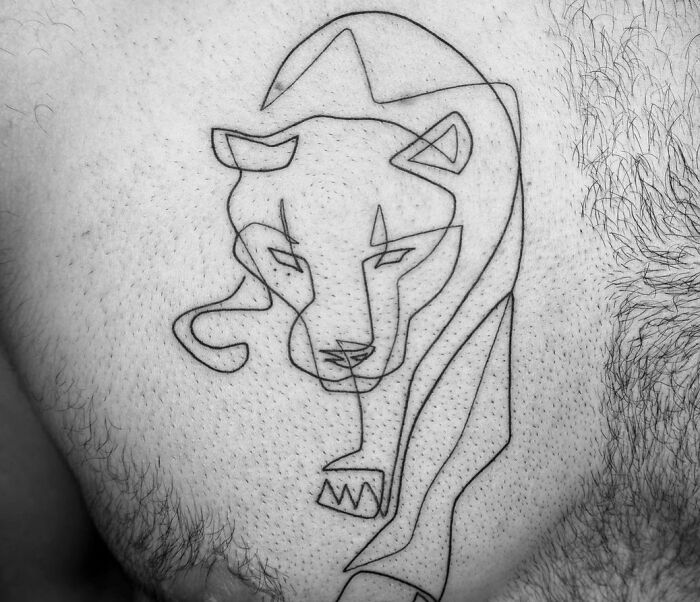 Single line sneaking panther chest tattoo