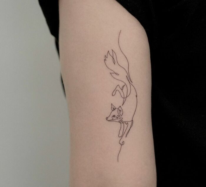 Single line jumping fox tattoo