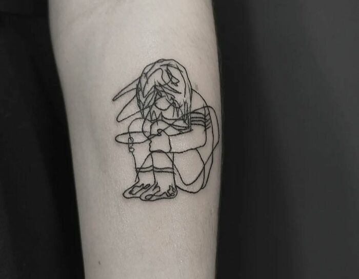 Single line sitting person tattoo