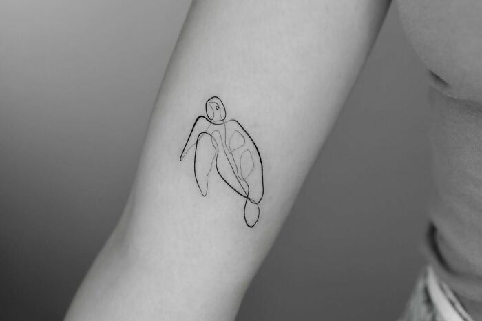 Single line turtle elbow tattoo