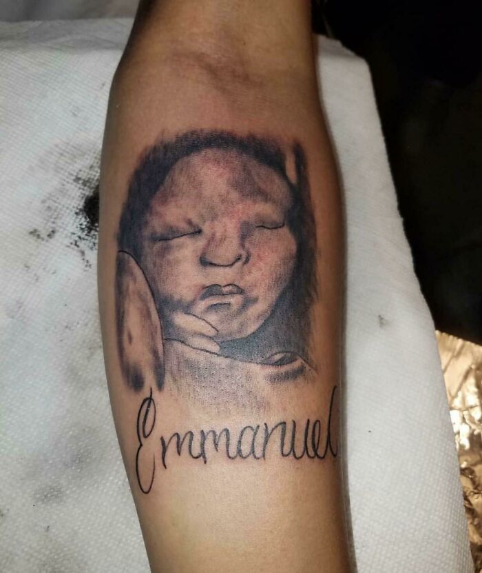 Poorly designed baby arm tattoo 