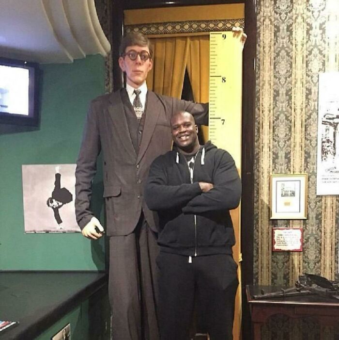 Shaq Standing Next To A Wax Figure Of Robert Wadlow, The Tallest Man In Recorded History
