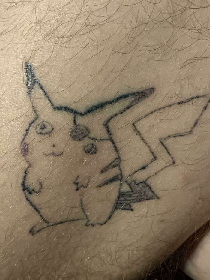 Funny tattoo sketch of Pikachu on skin.