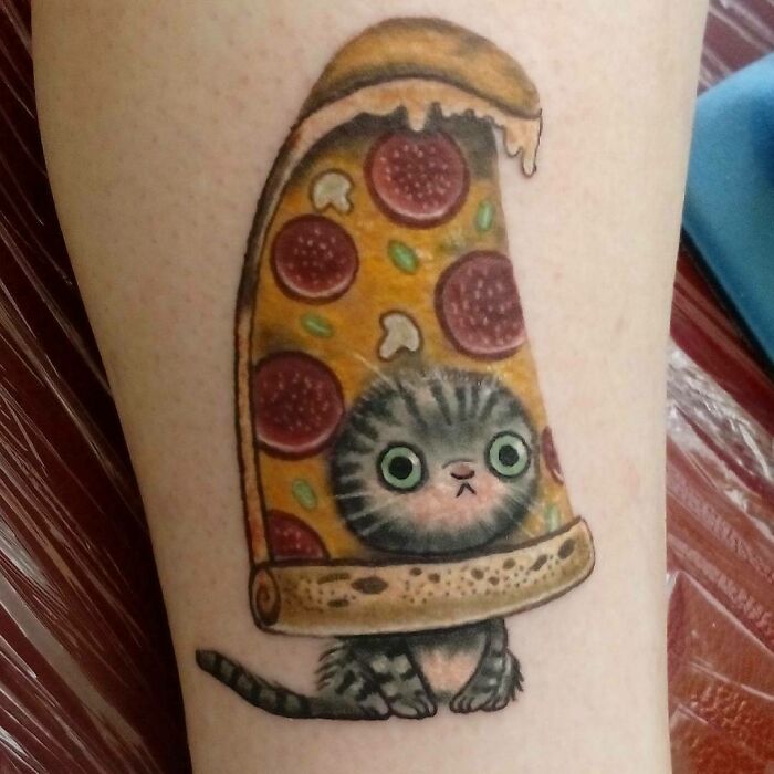 Kitty with pizza face arm tattoo 