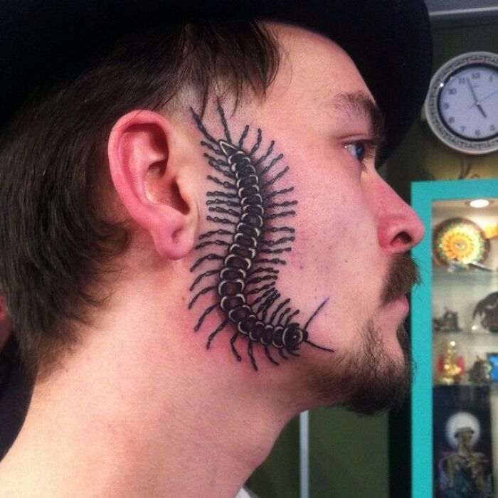 Centipede face tattoo 