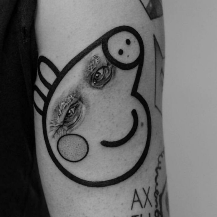 Funny tattoo with a quirky face design featuring realistic eyes on an arm.