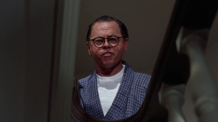 Mickey Rooney wearing a white t-shirt in Breakfast at Tiffany movie 