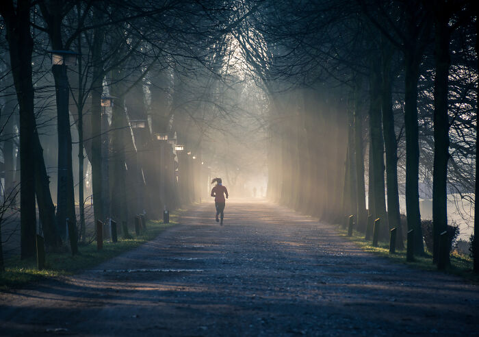Woman running on a pathway in the park 