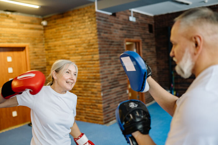 Old couple doing boxing exercises 