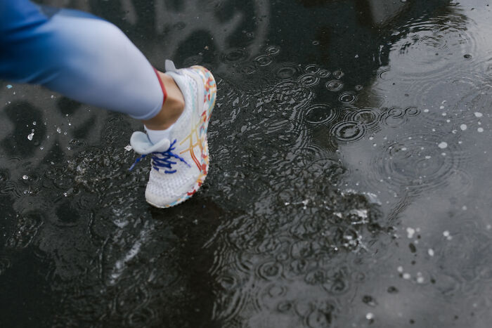 Person running in the rain 