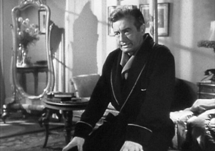 Claude Rains wearing a rob in "Notorious" movie 