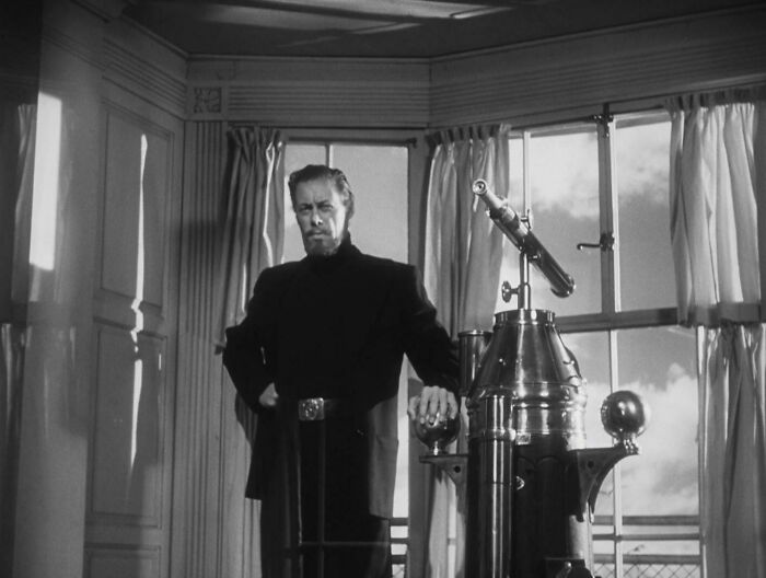 Rex Harrison in "The Ghost and Mrs. Muir" movie wearing jacket and turtleneck 