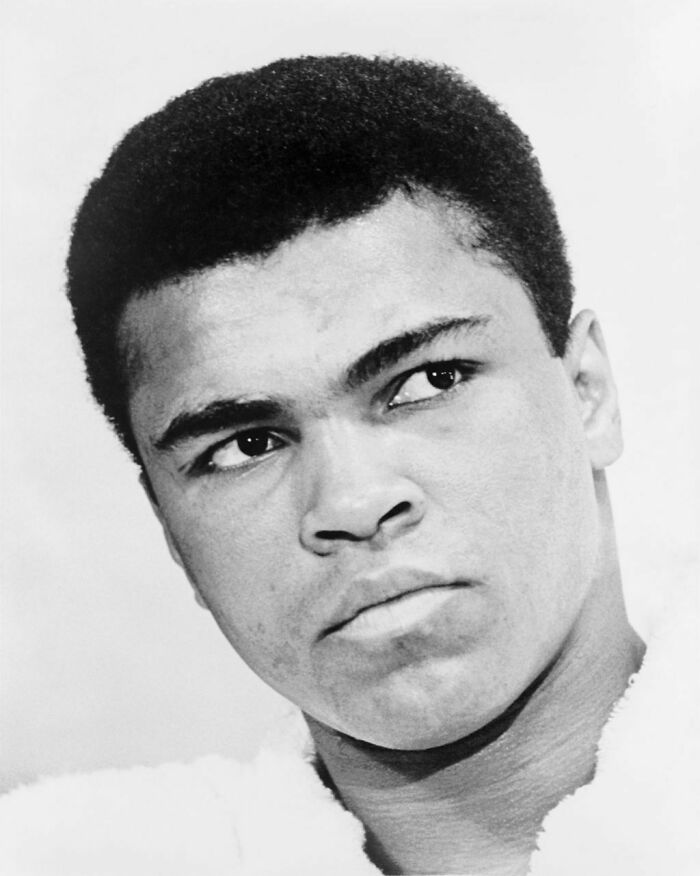 Muhammad Ali wearing a white robe 