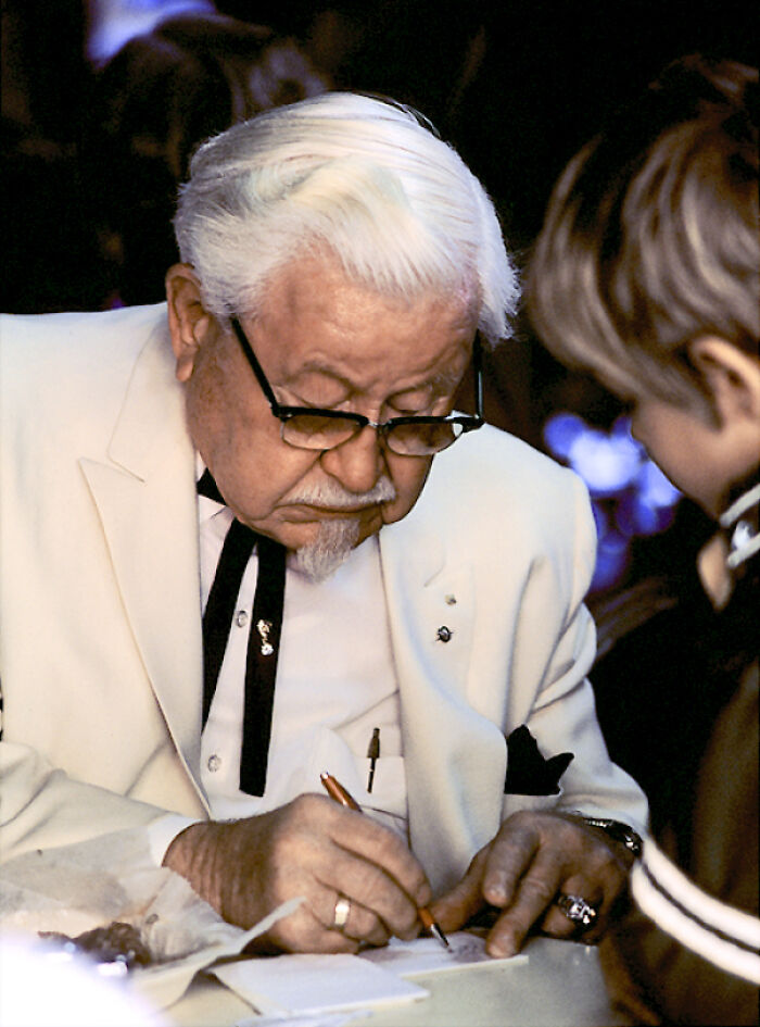 Picture of Colonel Sanders signing