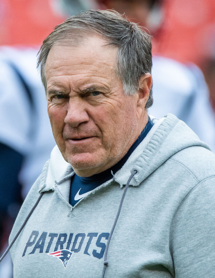 Picture of Bill Belichick wearing grey hoodie and looking