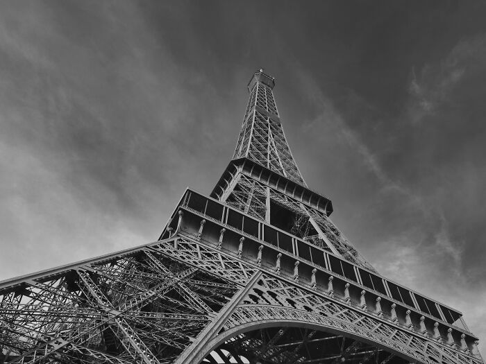Black and white picture of the Eiffel Tower from below 