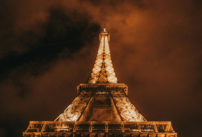 The Eiffel Tower lit up in the evening 