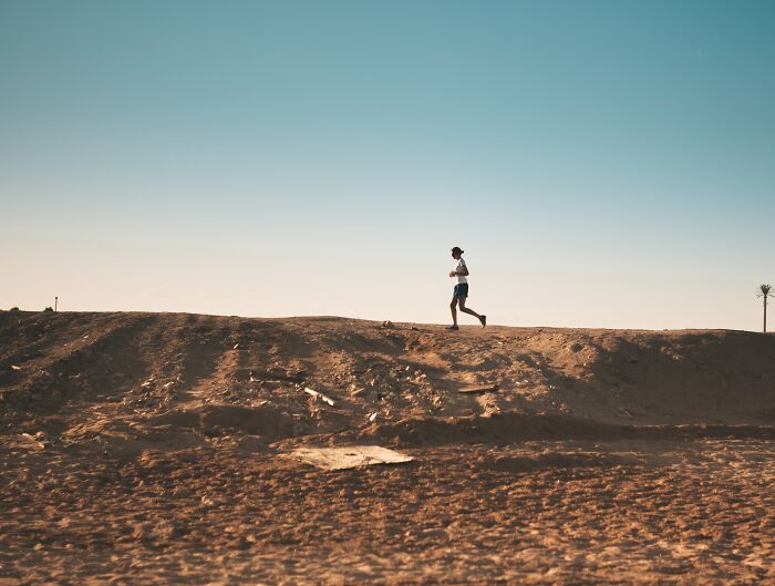 Person running on sand 