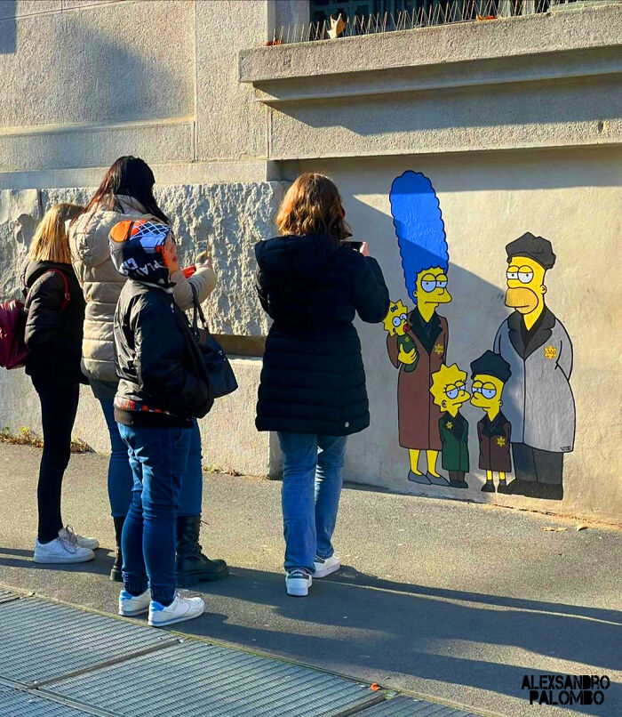 This Artist Paints ‘Simpsons’ Characters As Holocaust Victims Outside The Milan Shoah Memorial