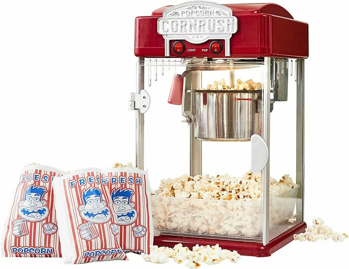 Cool looking Popcorn Machine with popcorn bags near 