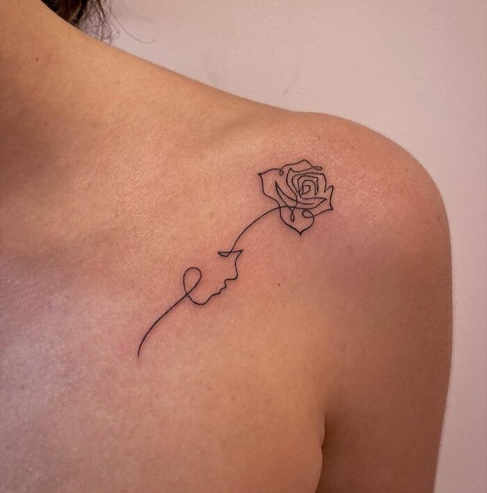 Rose and face single line shoulder tattoo