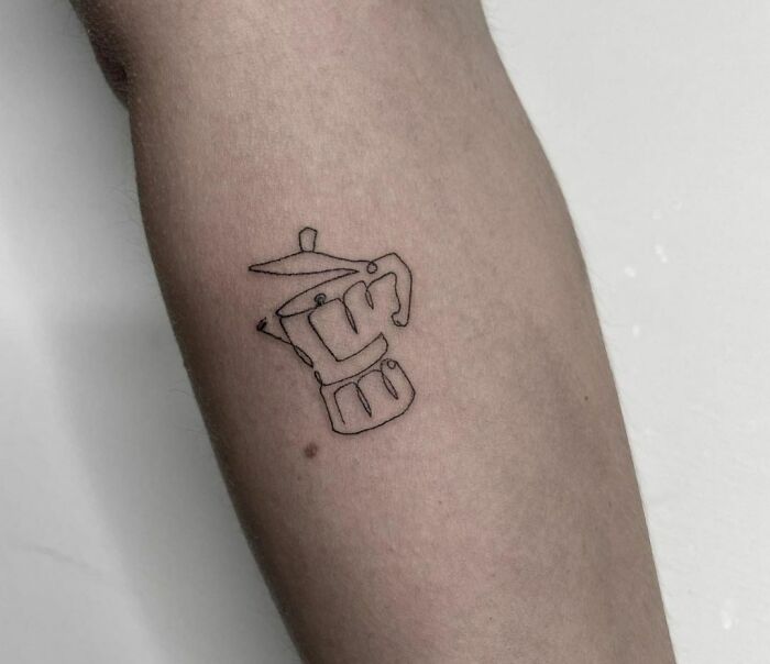 Single line moka arm tattoo