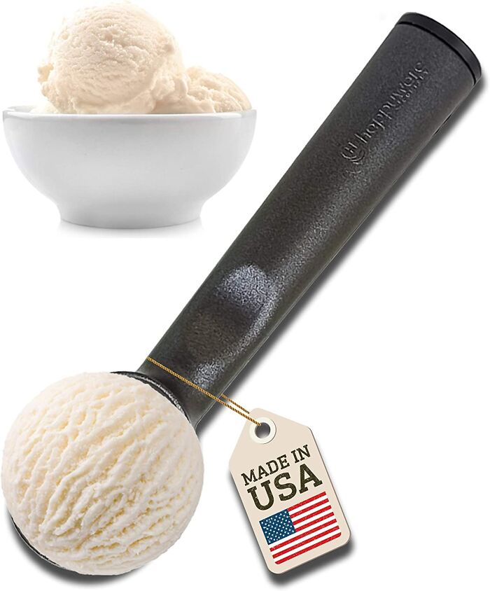 Black Warming Ice Cream Scoop with white ice cream inside 