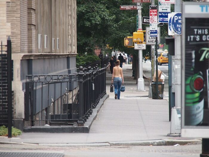 Woman walking topless in New York 