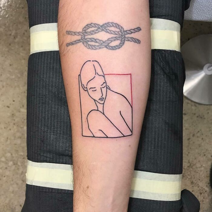 Arm with celebrity tattoos, featuring a minimalist portrait and a rope knot design.