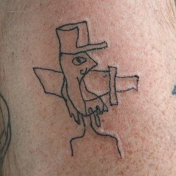 Funny tattoo of a sketchy bird wearing a top hat drawn on skin.