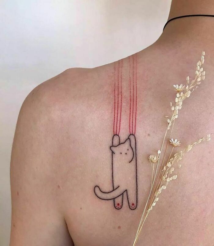 Minimalistic cat scratch tattoo on back