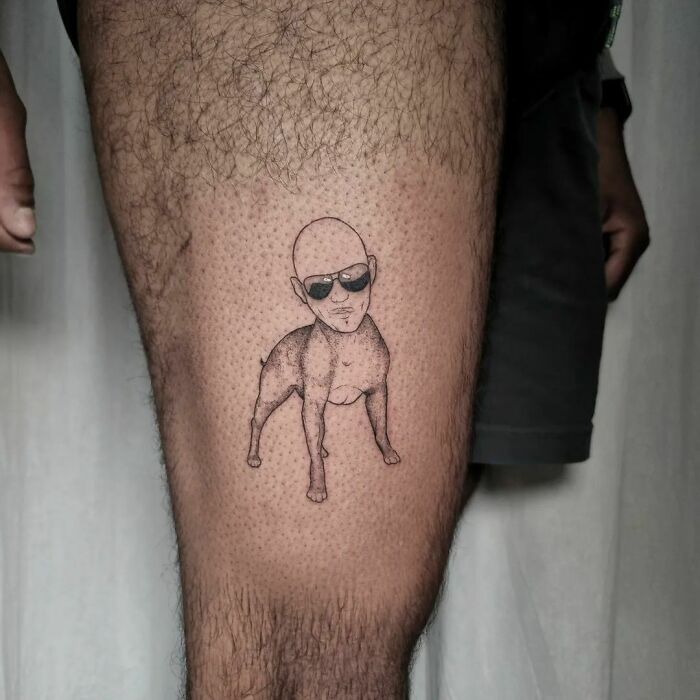 Pitbull with Pitbull's face leg tattoo 