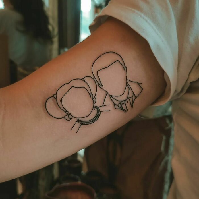 minimalistic tattoo of silhouette of two people