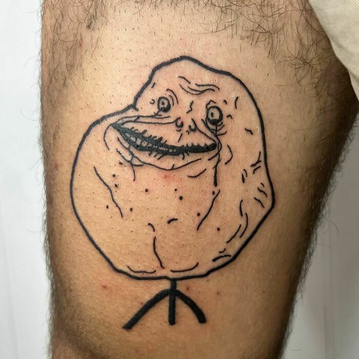 Forever Alone meme leg tattoo 