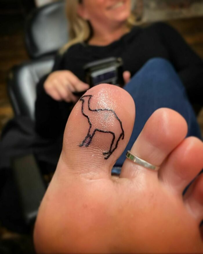 Small camel tattoo on a toe 