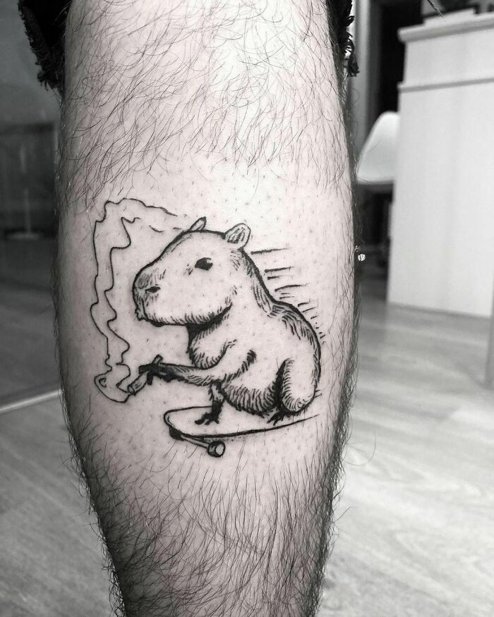 Skating Capybara and Smoking leg tattoo 