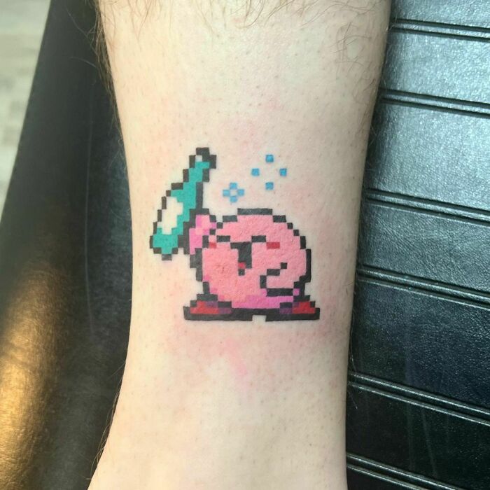 Colorful drinking Kirby leg tattoo 