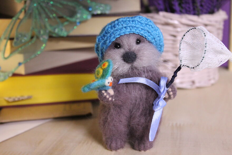 Otter With A Butterfly