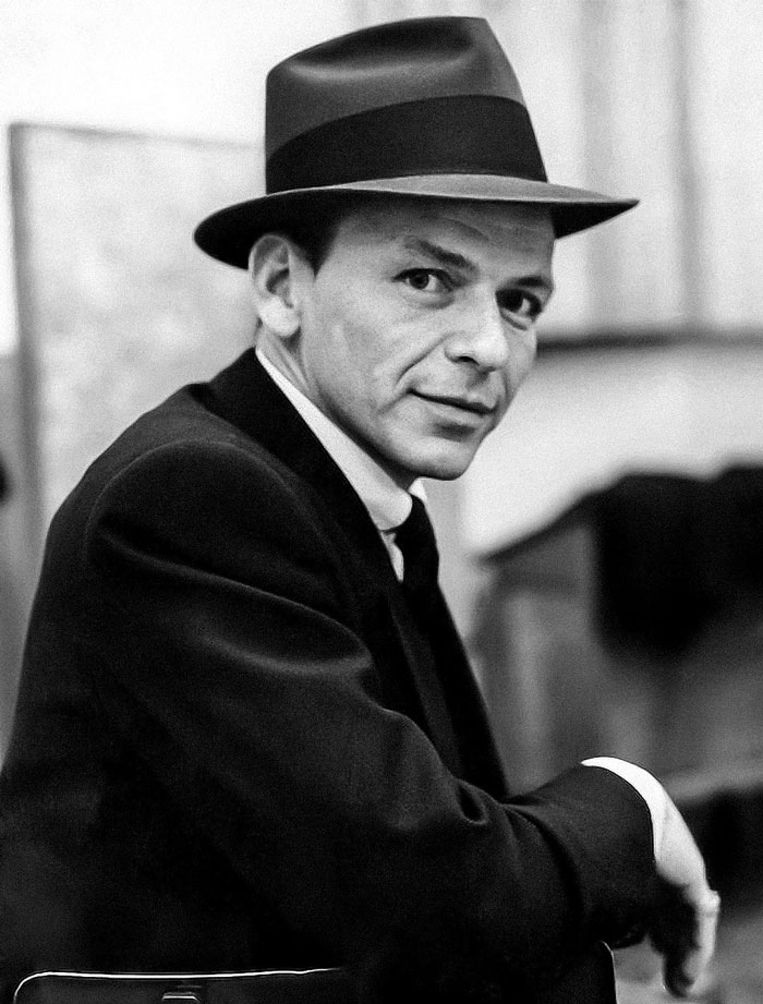 Frank Sinatra wearing black hat and suit 
