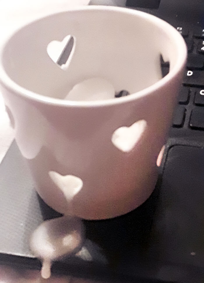 This Candle Has Heart-Shaped Holes In Its Holder What Cause Any Melted Wax Made When The Candle Is Lit To Leak Out