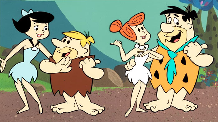 Fred and Wilma, Betty and Barney talking and smiling from The Flintstones