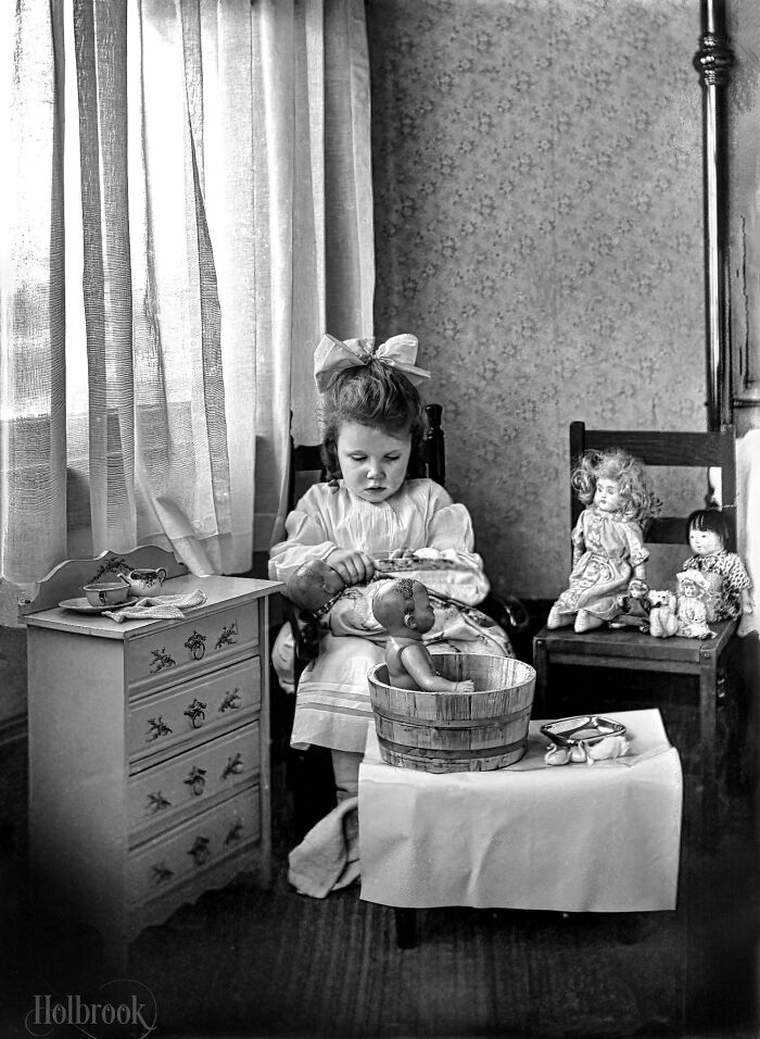 Little Girl Tending To The Care Of Her Dolls. Early 20th Century Glass Negative