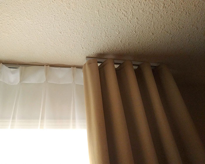 The Heavy Curtains In My Hotel Room Are On Smaller Tracks That Don't Allow Them To Cover The Window