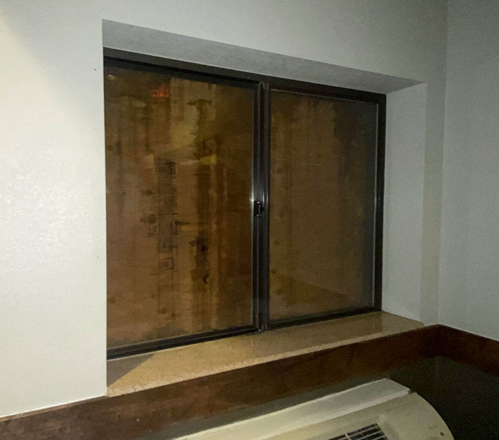 I'm Staying In The Hotel Where Windows Are Blocked With Wooden Boards