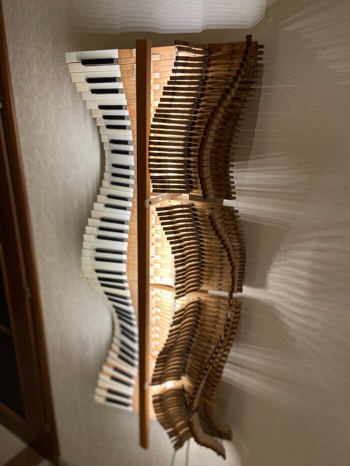 The "Musical Wave" Installation Is Made Of The Keys Of An Antique 19th Century Grand Piano. The Keys Are Made Of Ivory.