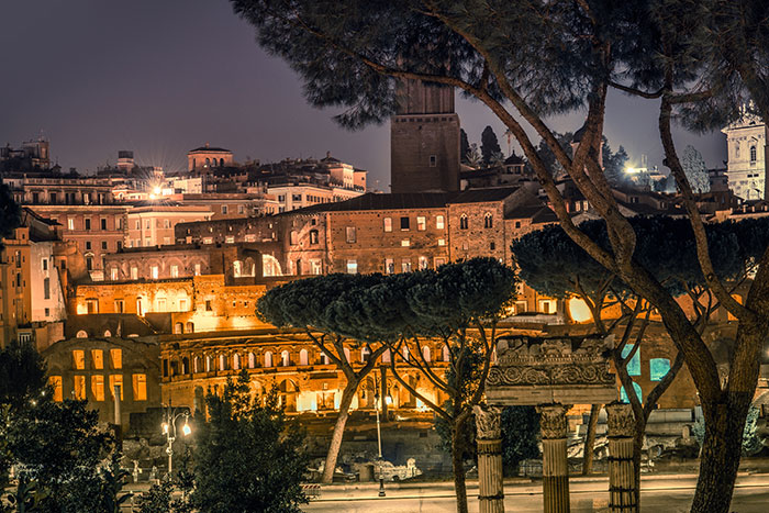 View of city of Rome at night with illuminated buildings and streets